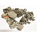 A SILVER AND WHITE METAL CHARM BRACELET Weight 101g.