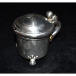 A VICTORIAN SILVER MUSTARD POT Of plain form with three ball feet and blue glass liner hallmarked