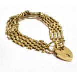 A 9CT GOLD HEART PADLOCK GATE BRACELET The heart marked 9.375 GJ Ltd, length approx. 15cm, weight