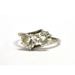 A TRANSITIONAL CUT DIAMOND TWO STONE RING The ring tension set with two diamonds calculated as 0.8ct