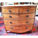 A GEORGE III MAHOGANY BOW FRONT CHEST OF TWO SHORT AND THREE LONG DRAWERS on splayed bracket feet,