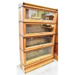 A FOUR TIER OAK GLOBE WERNICKE SECTIONAL BOOKCASE 87cm wide 27cm deep 142cm high Condition