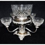 A SILVER PLATED EPERGNE Ornately decorated with copper detail, the central column with four scroll