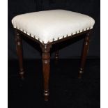 A SMALL UPHOLSTERED STOOL on ring turned mahogany supports, 40cm x 30cm, 36cm high Condition