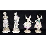 TWO PAIRS OF CONTINENTAL HARD PASTE FIGURES: one a pair of dancing ladies on gilt rococo bases,