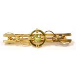A LATE 19TH EARLY 20TH CENTURY GREEN AQUAMARINE BAR BROOCH The centrally set faceted round cut green