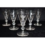 A SET OF SIX WINE GLASSES the half fluted conical bowls engraved with a winged dragon and