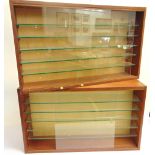 A PAIR OF GLAZED WOOD WALL DISPLAY CABINETS each with five adjustable glass shelves and sliding