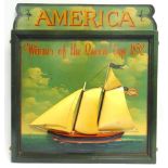 A PART-PAINTED WOODEN SIGN 'AMERICA / Winner of the Queen Cup 1852', incorporating a half-hull model