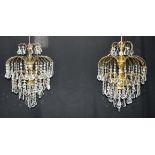 A PAIR OF CONTINENTAL THREE LIGHT CHANDELIERS with four tiers of hanging glass drops, 60cm high