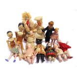 TEN BISQUE DOLL'S HOUSE DOLLS the largest 11cm high (one with broken feet; two with broken arms);