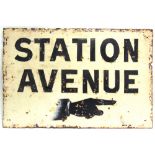 AN ENAMEL SIGN overpainted 'STATION / AVENUE', with a directional finger pointing to the right, 60.