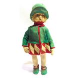 A LENCI STYLE CLOTH DOLL with a blonde wig, painted brown side-glancing eyes, and a jointed body,