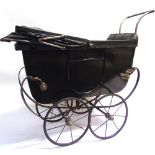 A DOLL'S PRAM the lined dark green wood body with a folding rexine hood, and a green padded