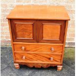 A SMALL VICTORIAN MAHOGANY COMMODE on turned supports, 64cm wide 46cm deep 74cm high Condition