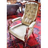 A WILLIAM IV MAHOGANY FRAMED LIBRARY CHAIR with button upholstered back, upholstered armrests to the