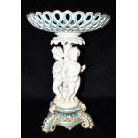A LARGE VICTORIAN FIGURAL COMPORTE the pierced basket 29cm diameter, the support with three cherubs,