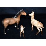A BESWICK NEW FOREST PONY 17cm high, together with a doe and fawn Condition Report : all three