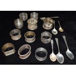 A COLLECTION OF SILVER comprising six assorted silver teaspoons and ten assorted silver napkin