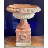 A LARGE LATE VICTORIAN/EARLY 20TH CENTURY TERRACOTTA URN the urns 64cm high, 72cm diameter at
