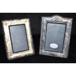 TWO SILVER MOUNTED PICTURE FRAMES ON STANDS 19cm x 16cm and 18cm x 13cm approx.