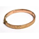 A LATE VICTORIAN 9CT ROSE GOLD HALF PATTERNED BANGLE hallmarked for Birmingham 1900 and fitted