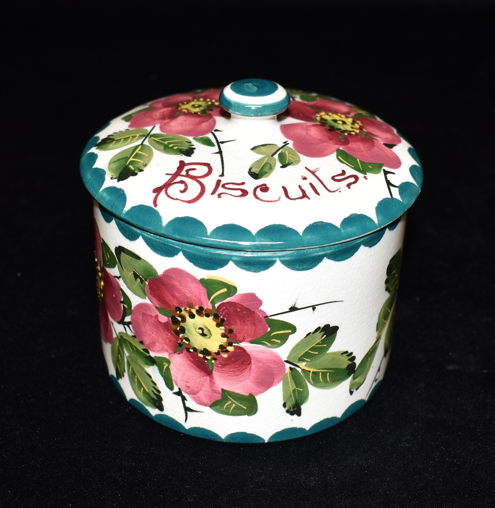 A WEMYSS WARE BISCUIT BARREL AND COVER of cylindrical form, painted with dog roses, painted to