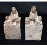 A PAIR OF CHINESE CARVED SOAPSTONE FIGURAL BOOKENDS probably 19th century, each with seated