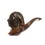 A ROYAL COMMEMORATIVE SOUVENIR PIPE the briar bowl carved as a bust portrait of Queen Victoria, with