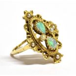 A MARKED 14KT OPAL AND SEED PEARL ORNATE NAVETTE RING the navette set with two pear shaped opals and