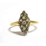 A VICTORIAN 18CT GOLD DIAMOND NAVETTE RING THE Navette set with 13 old cut diamonds in various