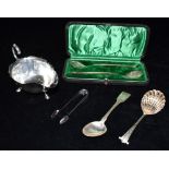 A COLLECTION OF SILVER comprising a silver sauce boat hallmarked for Birmingham 1929, maker A