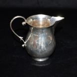 AN EDWARD VIII SILVER JUG Of plain form with scroll handle, hallmarked for Chester 1936, maker