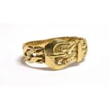 A 9CT GOLD BELT AND BUCKLE RING The ring with fancy open work shoulders and faded 375 hallmark to