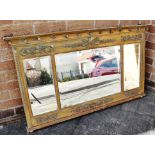 A REGENCY STYLE GILT FRAMED OVERMANTLE MIRROR the cornice applied with balls, the frieze applied