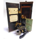 AN R.J. BECK LTD 'LONDON MODEL 22' MONOCULAR MICROSCOPE serial number 3324, the black japanned