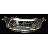 A LATE VICTORIAN SILVER BASKET with openwork sides and two handles/supports, hallmarked Sheffield