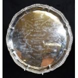 AN INDIAN SILVER TRAY On three patterned feet with raised fancy border, the tray engraved with a