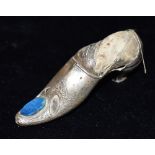A SILVER PIN CUSHION designed as a lady's shoe, faded hallmark, maker A & L Ltd., 9cm long, height