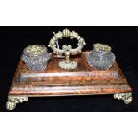 A TORTOISESHELL AND GILT METAL DESK STAND fitted with two matched inkwells, 25cm wide Condition