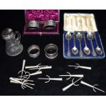 A COLLECTION OF SILVER COMPISING A cased set of two napkin rings, a cased set of six teaspoons two