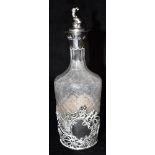 AN EDWARDIAN SILVER HELD COLLARED AND STOPPER CUT GLASS BOTTLE The silver hallmarked for London 1902