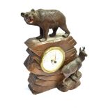 A BLACK FOREST BAROMETER modelled with a bear and goat on rocky outcrop, 30cm high overall Condition