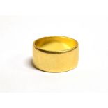 A 22CT GOLD WIDE BAND RING the ring with faded Birmingham hallmark, ring size M, band width 0.9cm,