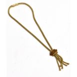 A 9ct GOLD SPESSARITE GARNET COLLAR NECKLACE The necklace with a five tail tassel pendant drop