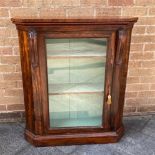 A ROSEWOOD DISPLAY CABINET having a single door opening to reveal two fittend shelves H 98cm x W