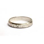AN 18CT WHITE GOLD PATTERNED BAND RING The shank hallmarked for Sheffield 1977 Maker C A & S, ring