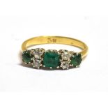 A MARKED 18CT EMERALD AND DIAMOND DRESS RING ring size M, weight 2.9grams