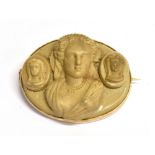 A LATE 19TH/EARLY 20TH CENTURY 9ct RAISED RELIEF CAMEO BROOCH The cameo in beige stone featuring a