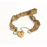 A 9CT GOLD HEART PADLOCK GATE BRACELET With safety chain, the bracelet approximately 15cm in